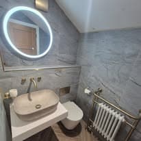 Contemporary ensuite with mirror lighting